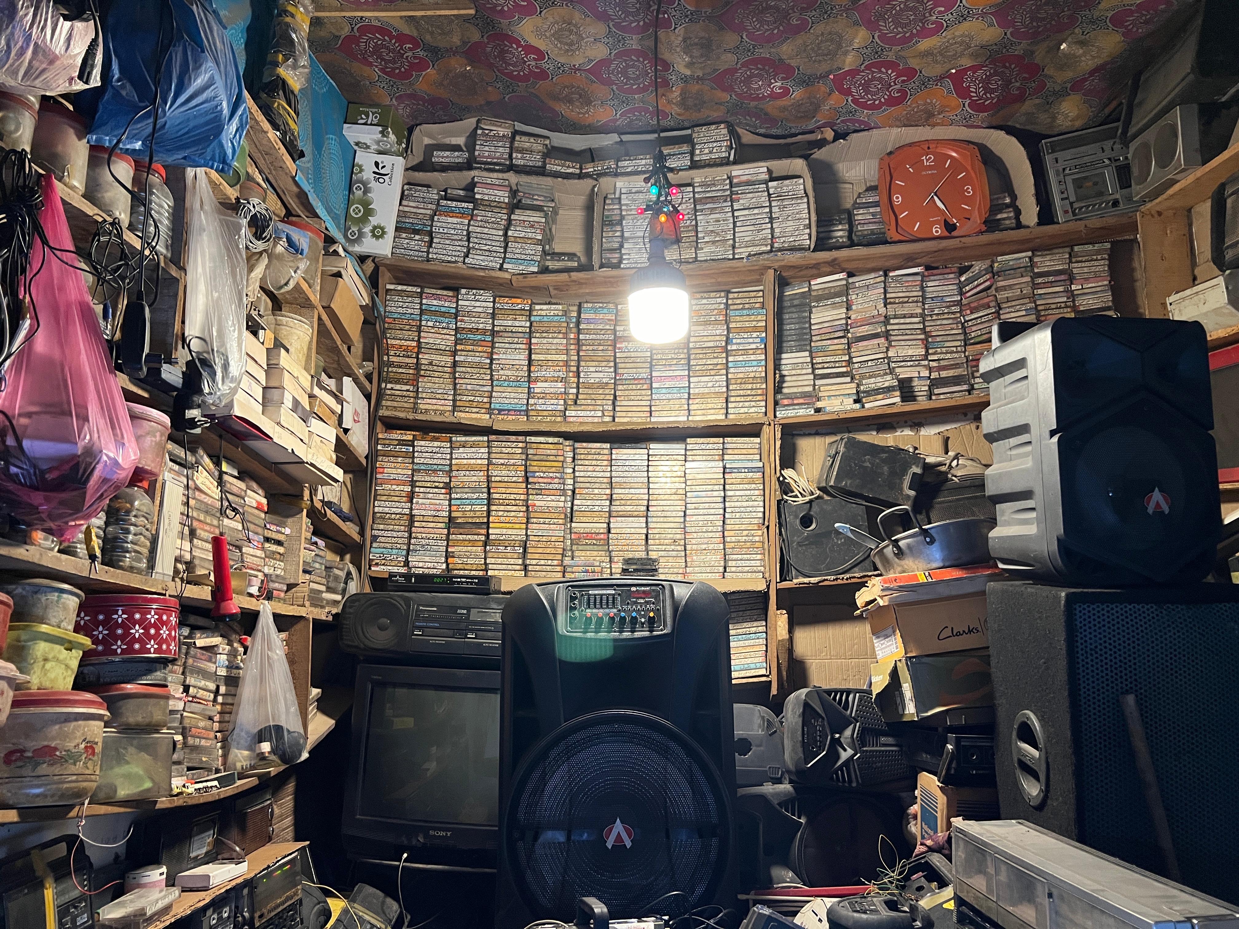Mohammad Hassan Kaka Zmarai with his cassette collection
